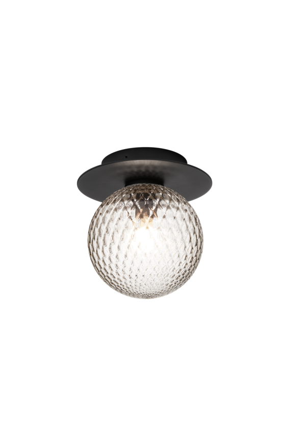 Væg-eller loftlampe med lampeskærm af klart optikglas og sort fatning, på hvid baggrund