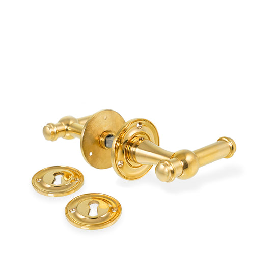 Ordrup dørhåndtag i blank messing inkl. roset og nøgleskilt (lille model)