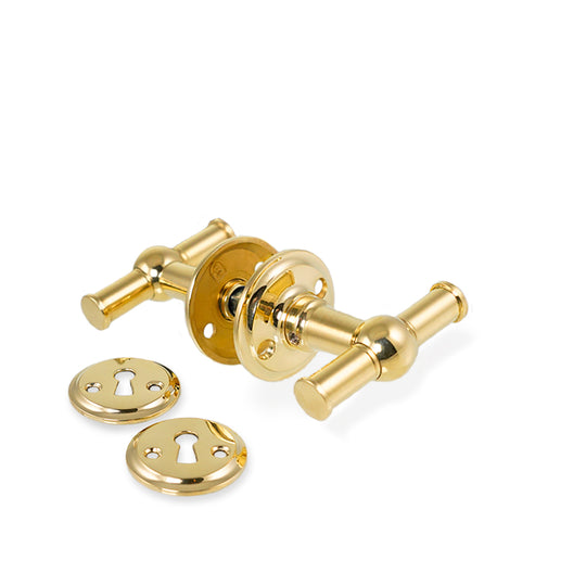 Rungsted krydsgreb dørhåndtag i blank messing inkl. roset og nøgleskilt